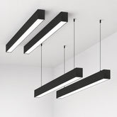 Black 4FT LED linear strip fixture installed on a modern ceiling for commercial office lighting applications