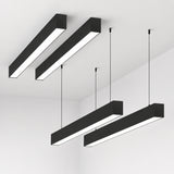 Black 4FT LED linear strip fixture installed on a modern ceiling for commercial office lighting applications