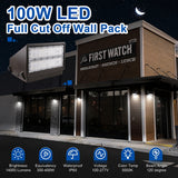100W Full Cutoff LED Wall Pack installed on a commercial building providing 14,000 lumens, built-in dusk-to-dawn photocell, selectable CCT, IP65 weatherproof protection, and DLC Premium performance.