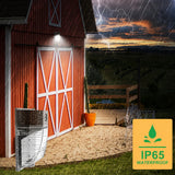 26W LED Mini Wall Pack installed outdoors in rainy weather demonstrating its IP65 waterproof rating for reliable commercial and residential exterior lighting.