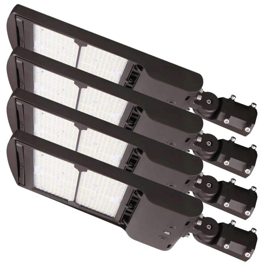 A diagonal overlapping arrangement of four bronze LED parking lot light fixtures with slipfitter mounts.
