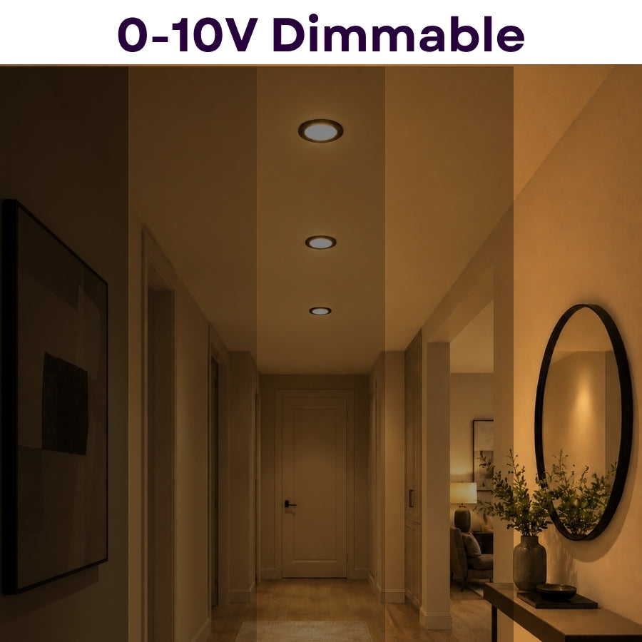A dimmable recessed ceiling light fixture shown installed in a hallway, with warm light turned on and a text banner at the top reading '0-10V Dimmable'.