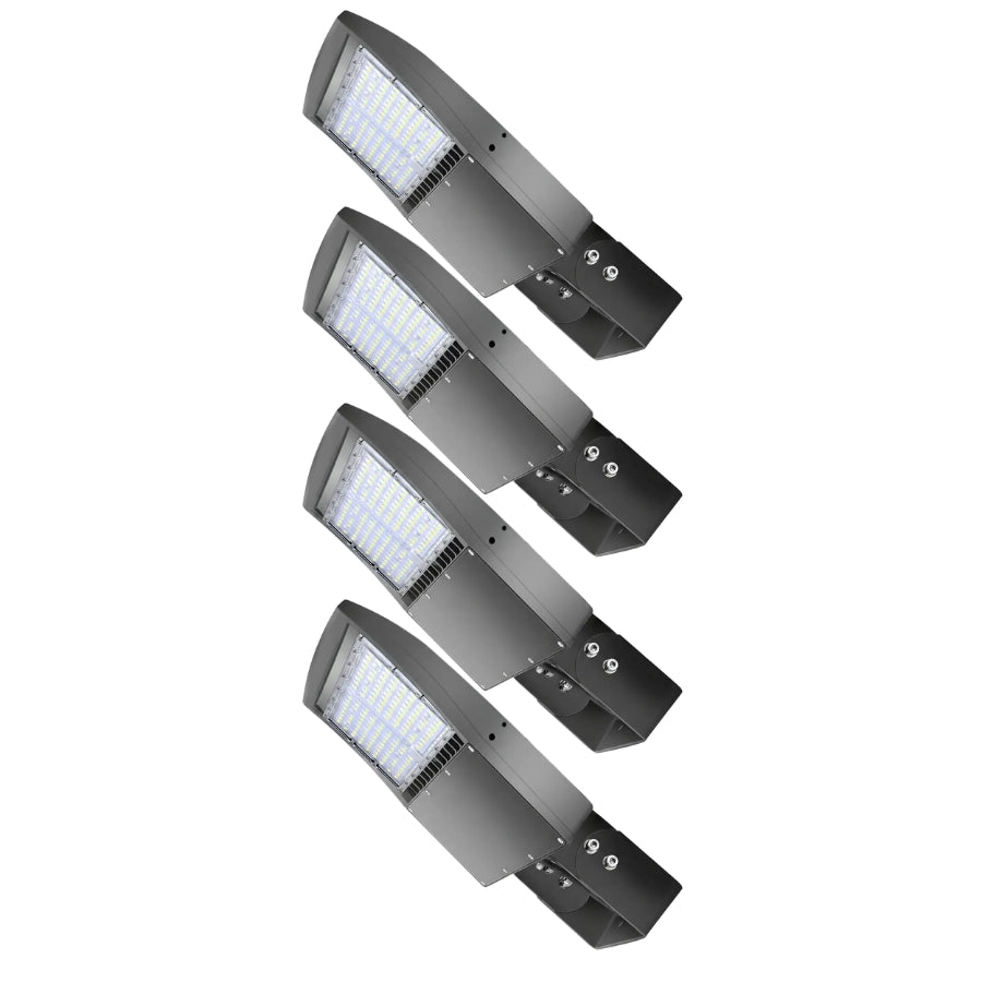 Four-pack of selectable LED parking lot lights with yoke mounts for commercial outdoor area lighting